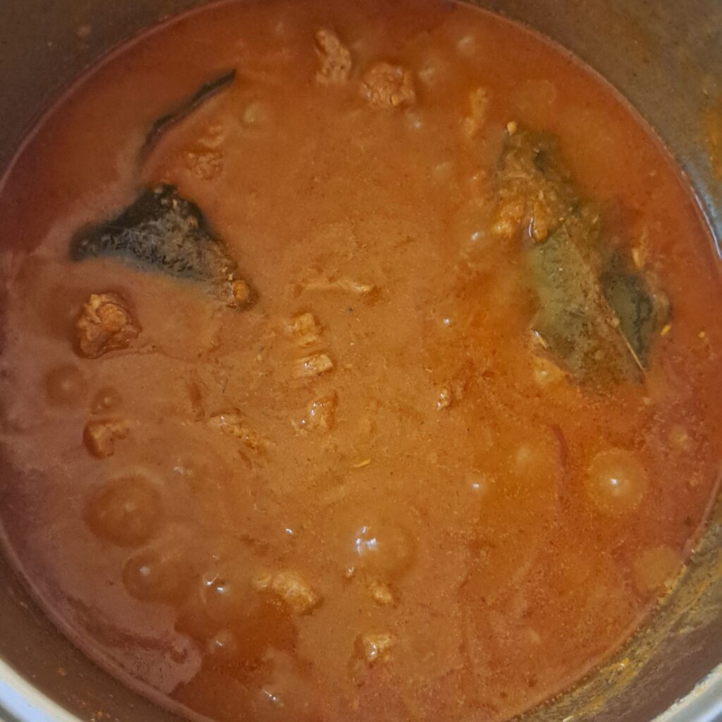 Fully cooked Homemade Beef Goulash in a deep pot, ready to serve.