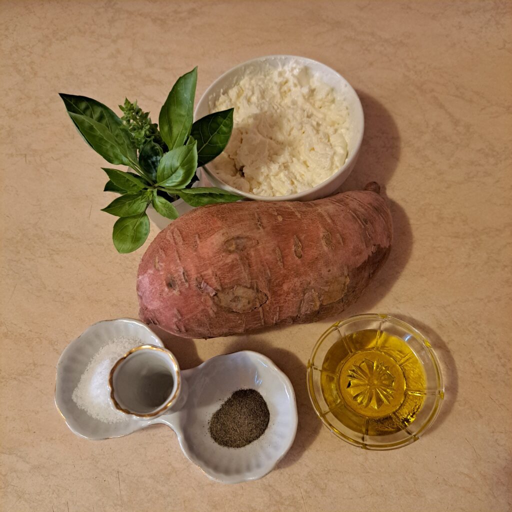 Whole sweet potato with ricotta, salt, pepper, olive oil, basil leaves, and basil microgreens.