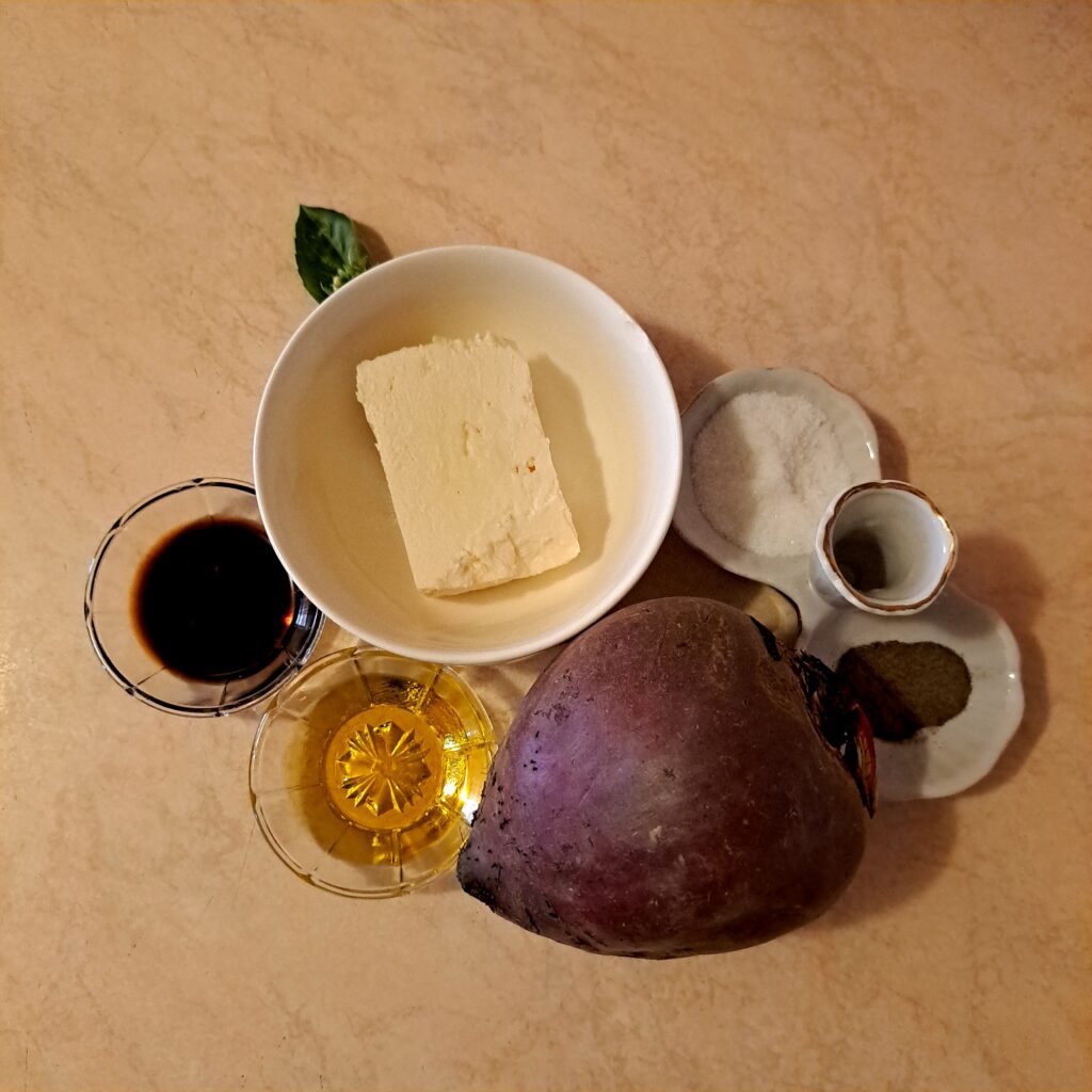 Whole beetroot with feta cheese, salt, pepper, balsamic vinegar, and olive oil.