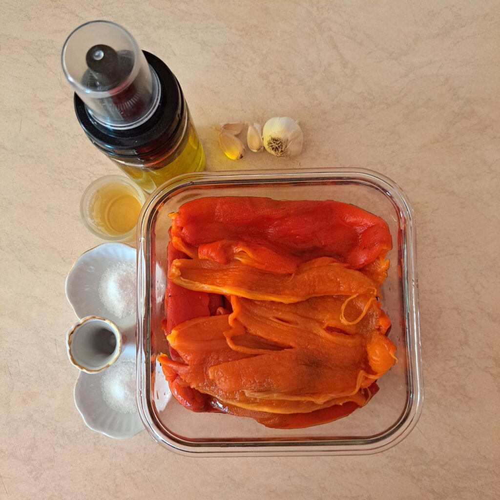 Roasted peeled peppers with olive oil, apple cider vinegar, garlic, and salt.