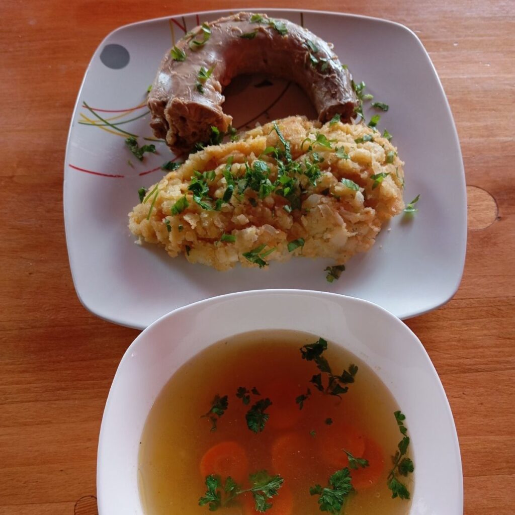 Boiled Turkey Neck Meal served as a single portion with mashed potatoes and soup.
