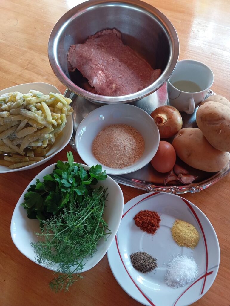 All ingredients for Turkey Patties with Potatoes and Green Beans neatly arranged on a table.