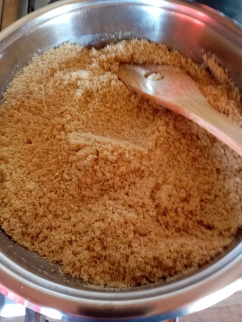 Butter and breadcrumbs lightly toasted and mixed with sugar in a pan.