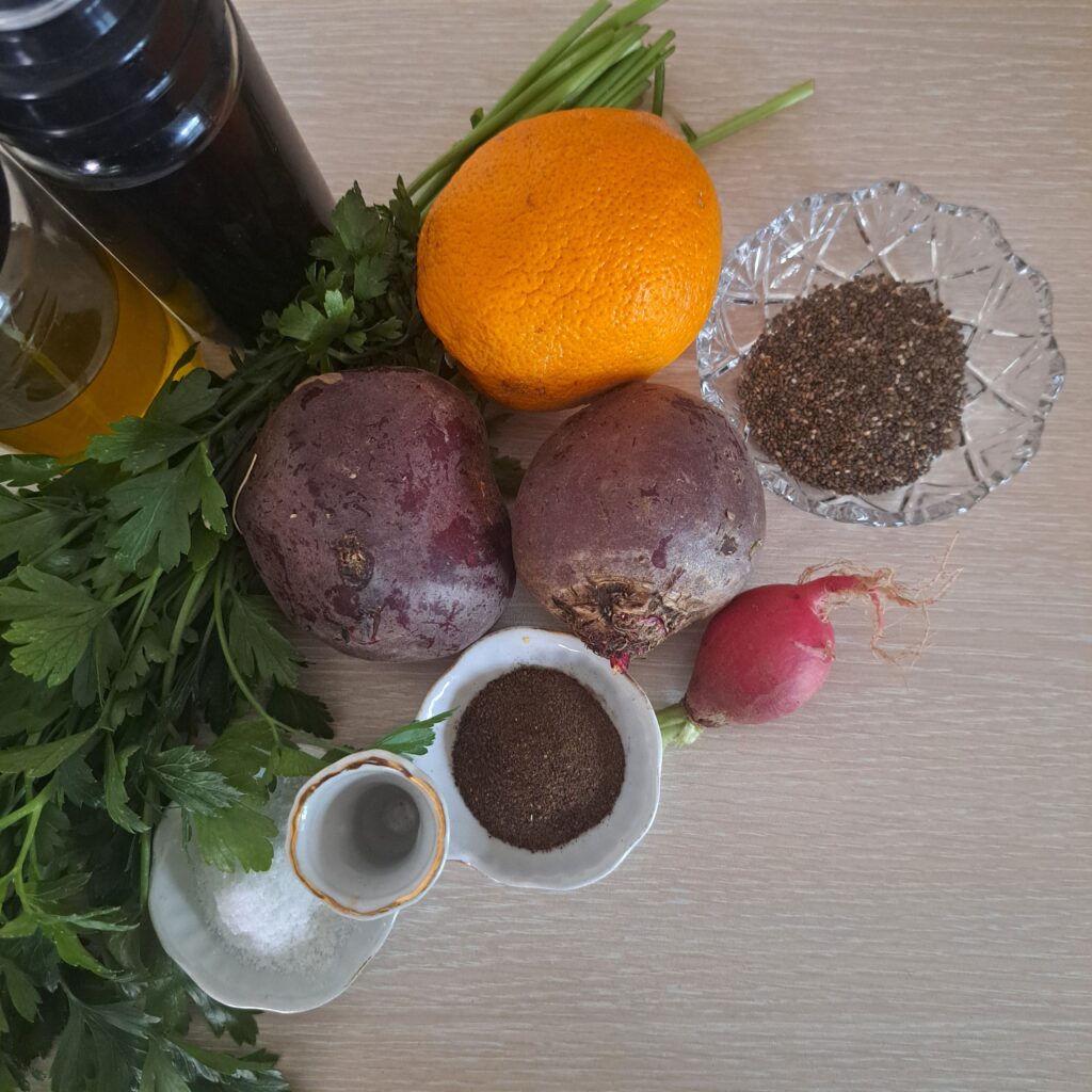 Fresh ingredients for Beetroot Orange and Chia Seed Salad – beetroot, orange, radish, chia seeds, parsley, olive oil, balsamic vinegar, salt, and black pepper.