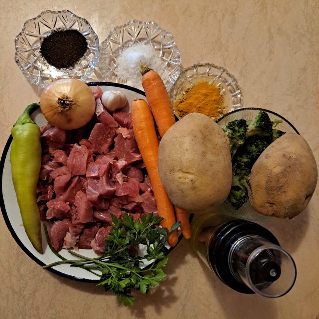 Selected ingredients for the soup: diced turkey, potatoes, carrots, onion, garlic, broccoli, green pepper, parsley, olive oil, and spices.