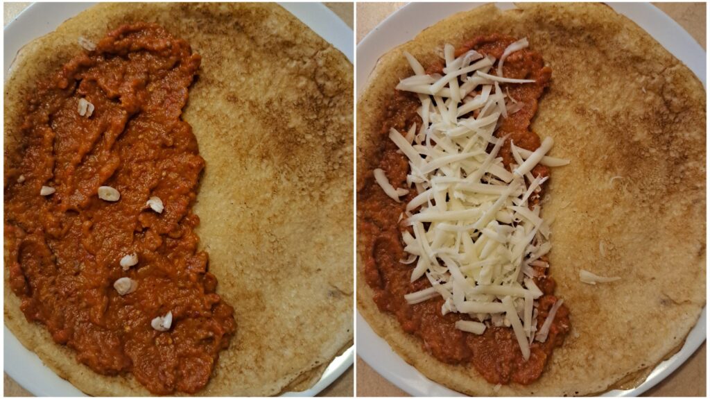 Preparing savory crepes by spreading ajvar with chopped garlic and sprinkling grated cheese.