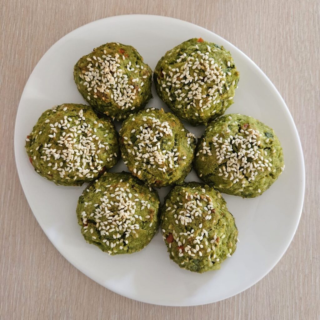 Crispy Pea Cheese Bites with Sesame served on a thin plate.