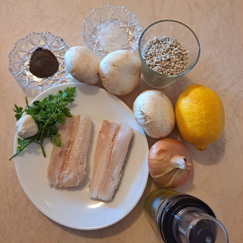 Ingredients for Seared Fish with Mushroom Barley including two fillets, barley, mushrooms, lemon, onion, garlic, parsley, olive oil, salt, and pepper. 