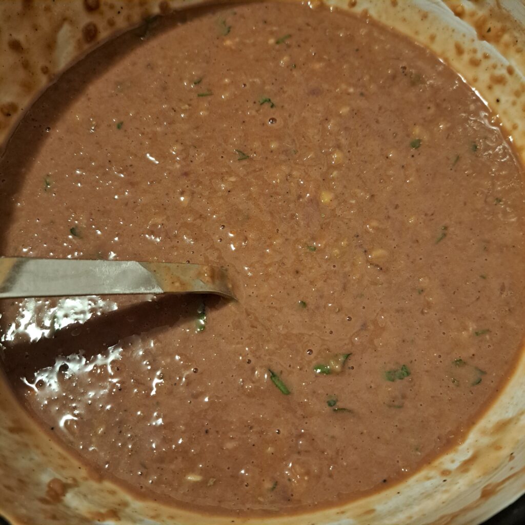 Prepared mixture for Pork Liver Potato Patties in a bowl, showing the smooth blended texture with herbs and spices.