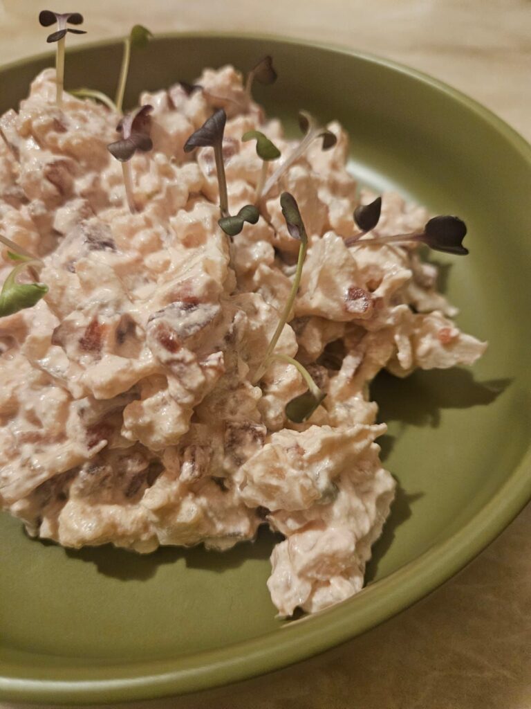 Close-up side view of Beet Cauliflower Creamy Salad, showing smooth creamy texture and soft pink color.