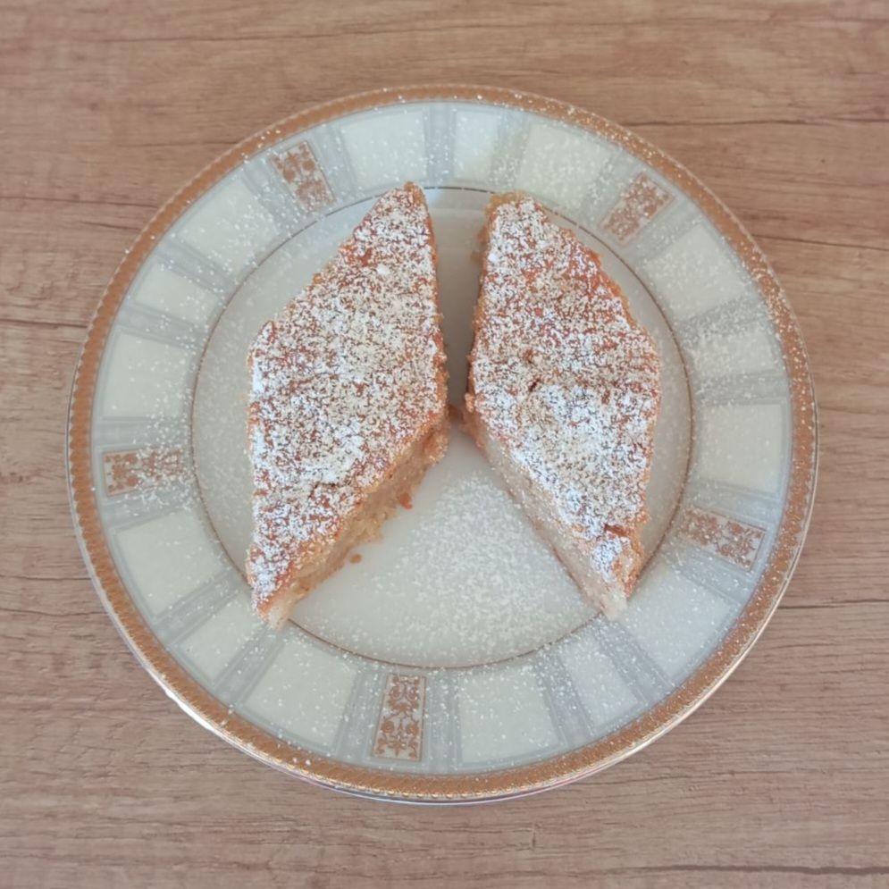 Two sliced pieces of Homemade Soft Apple Cake served on a plate.