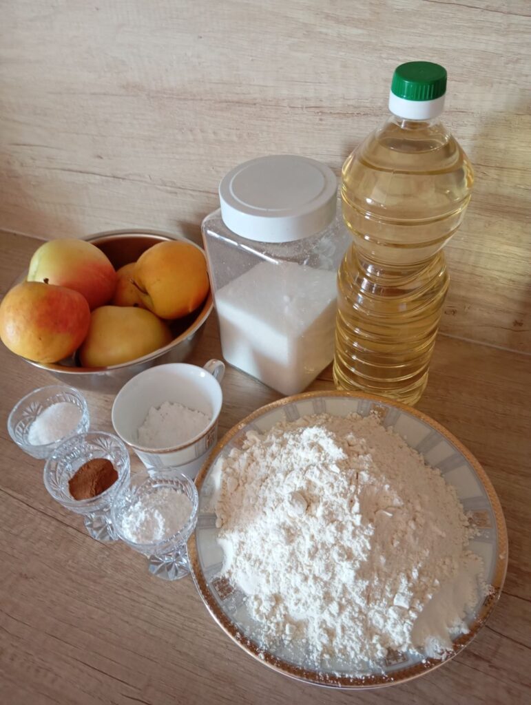 Measured ingredients for Homemade Soft Apple Cake arranged on a kitchen surface.