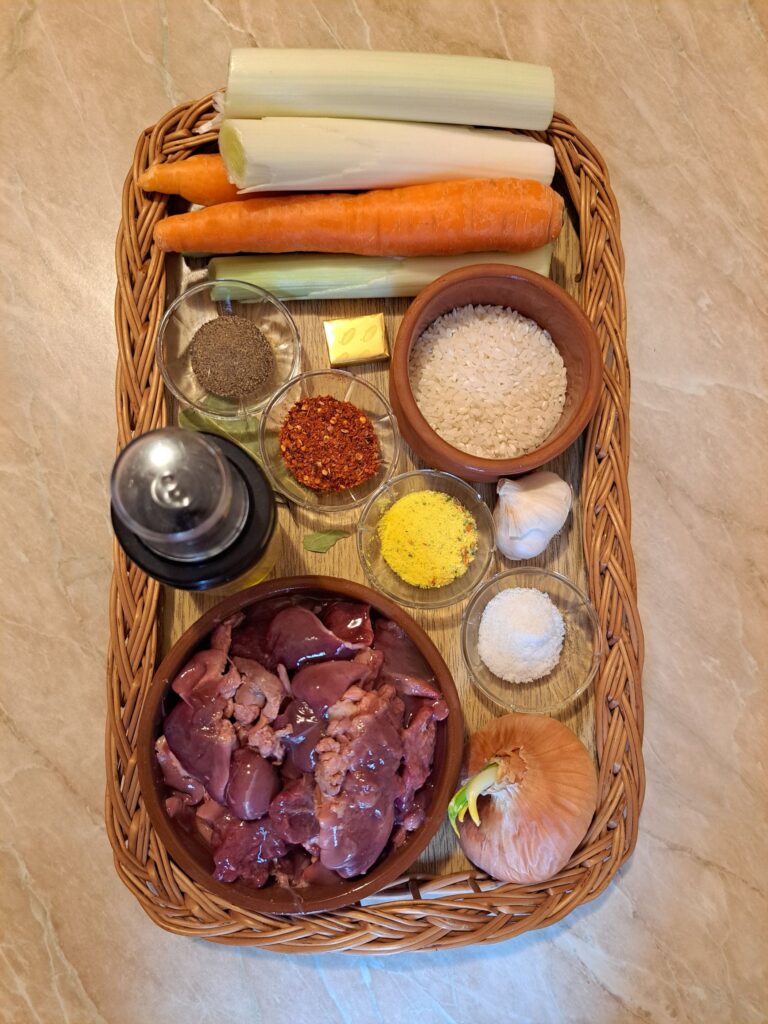 Ingredients for braised chicken livers rice arranged neatly on a table, ready for cooking.