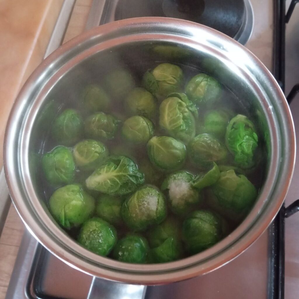Brussels sprouts boiling in lightly salted water.