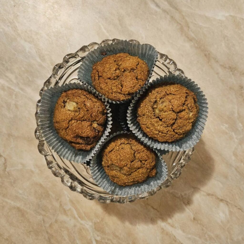 Chocolate Banana Oat Muffins served in a glass bowl, ready to enjoy and share.